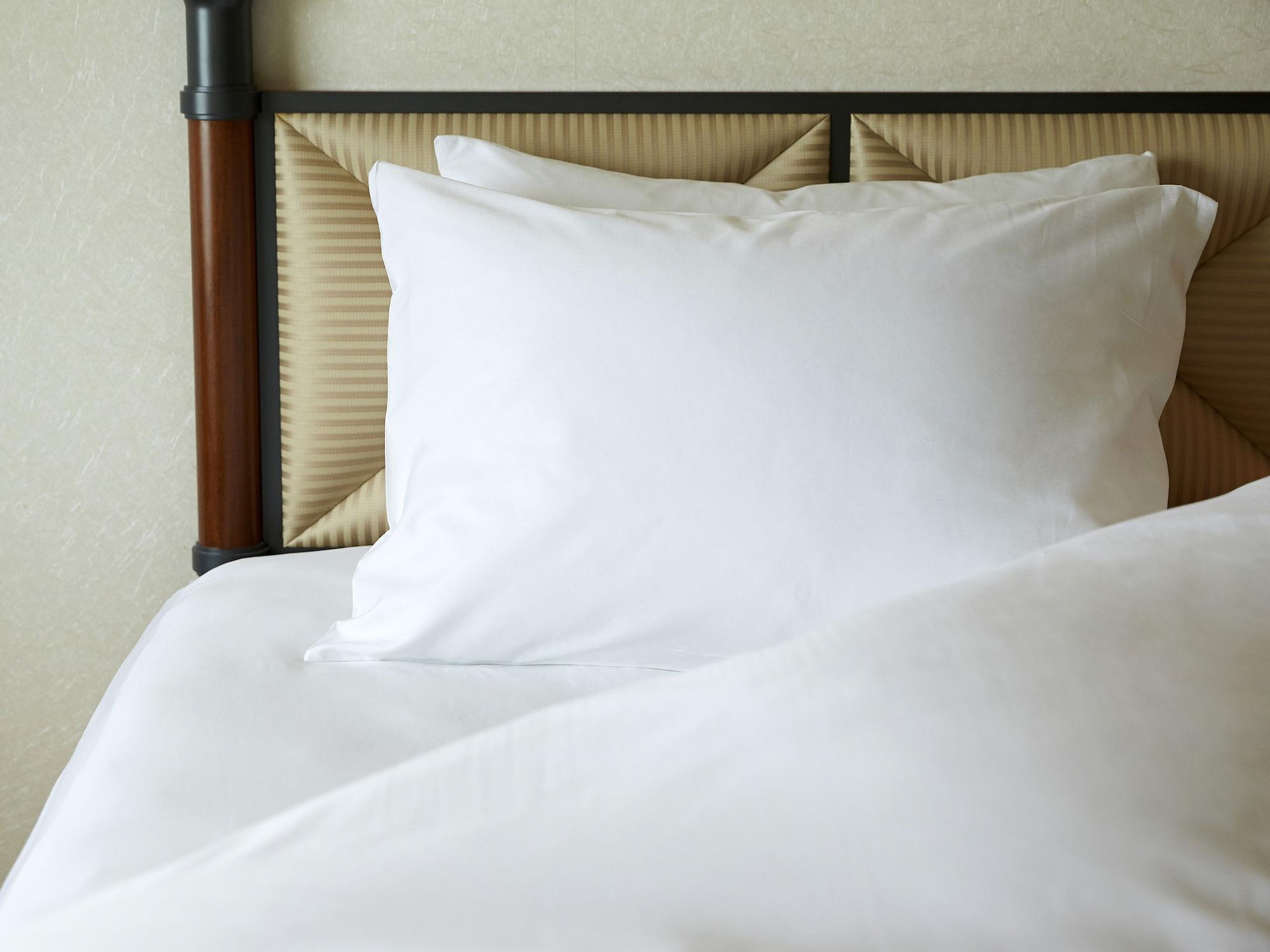 Miyako Hotel Gifu Nagaragawa Exteriör bild A pillow on a bed